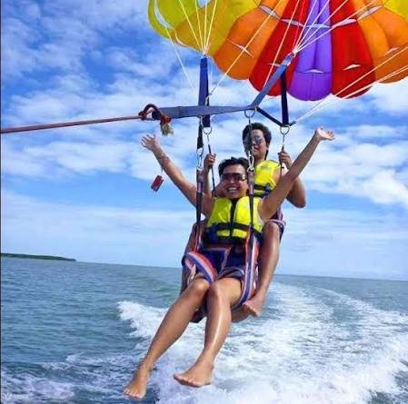 Parasailing over beach